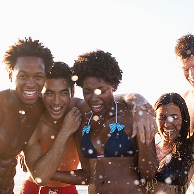 Multi-ethnic group of friends enjoying a day by the beach.